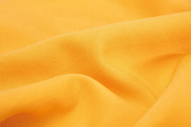 Serviette de voyage ultralégère Cocoon – gros plan sur le coloris orange