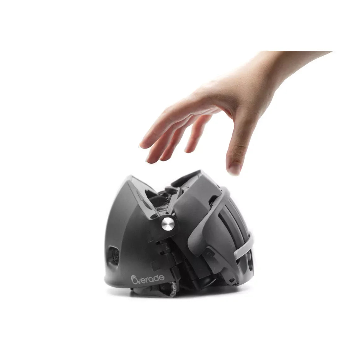 casque noir Overade PLIXI FIT - vue replié avec une main qui va prendre le casque