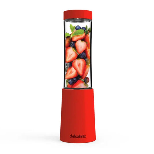 Mini Blender Detoximix rouge avec des fruits entiers pour illustration